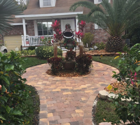 front yard grass landscaping trees flowers stone path palm bay fl